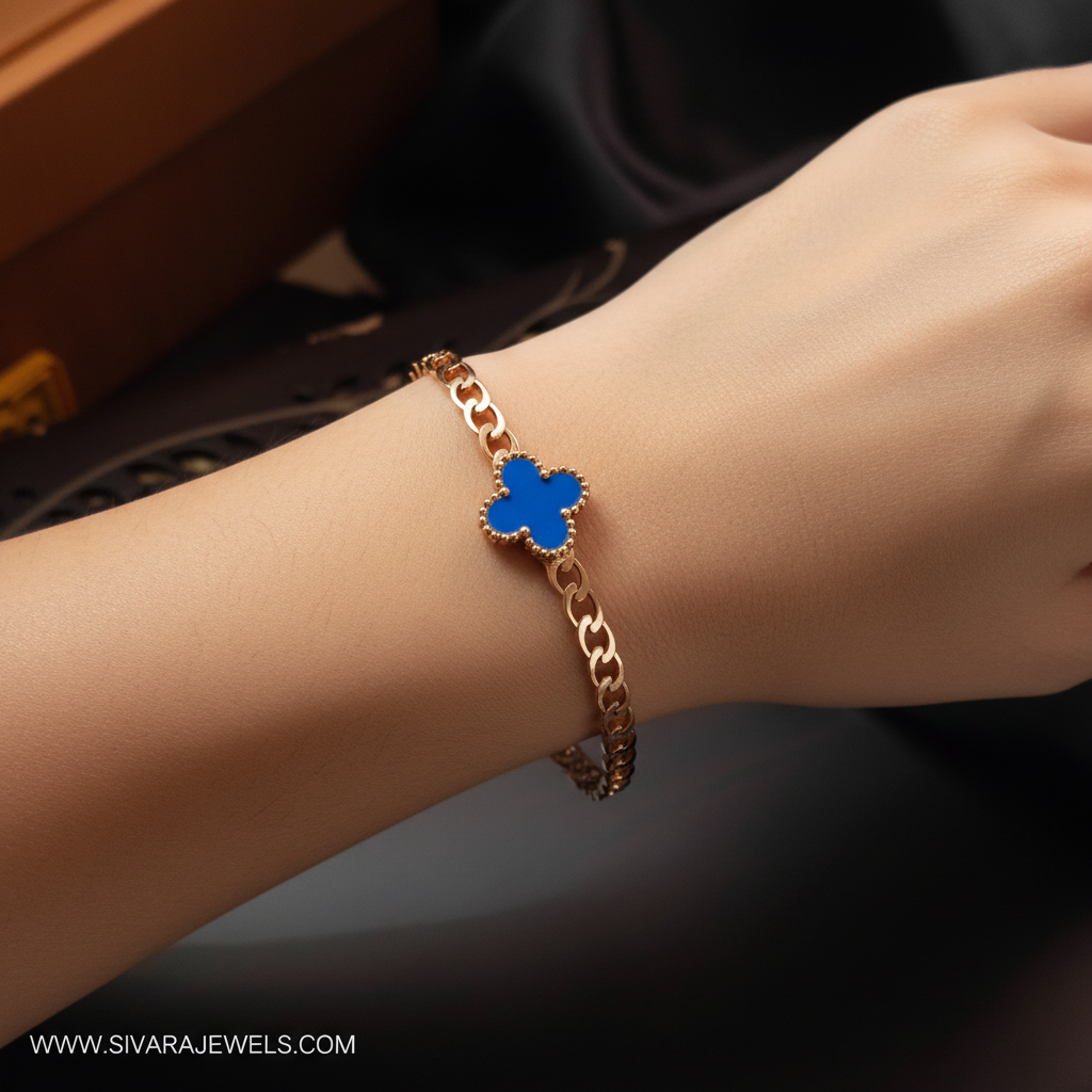 Beautiful slender wrist with rose gold and blue enamel quatrefoil chain bracelet