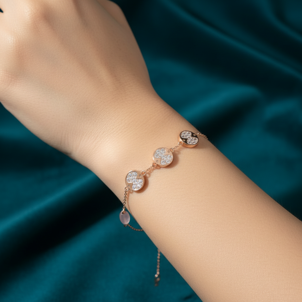 Beautiful slender wrist with rose gold diamond quatrefoil and rose quartz bracelet