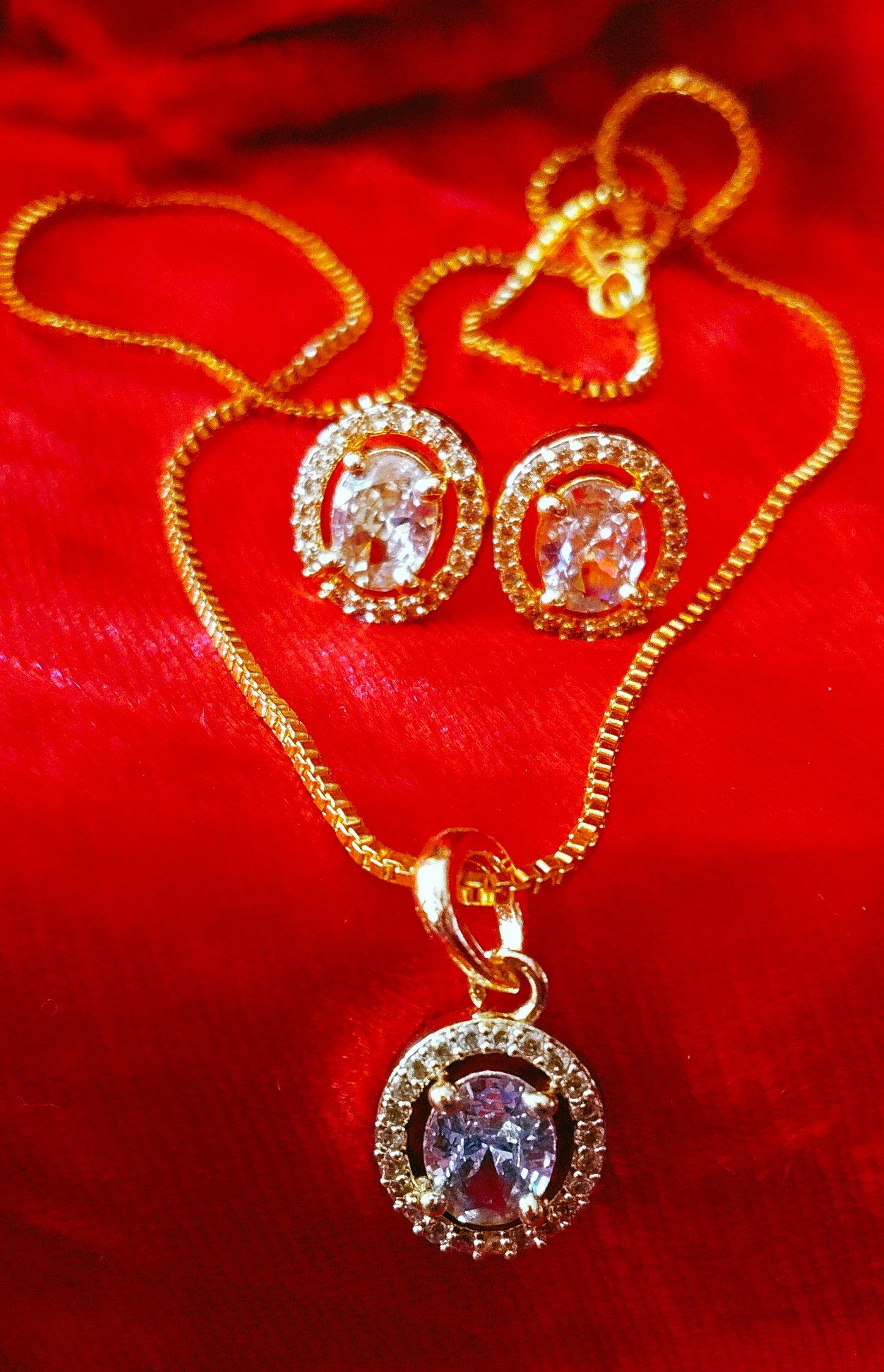SIVARA Gold Plated Oval AD Pendant Set with Earrings for Women