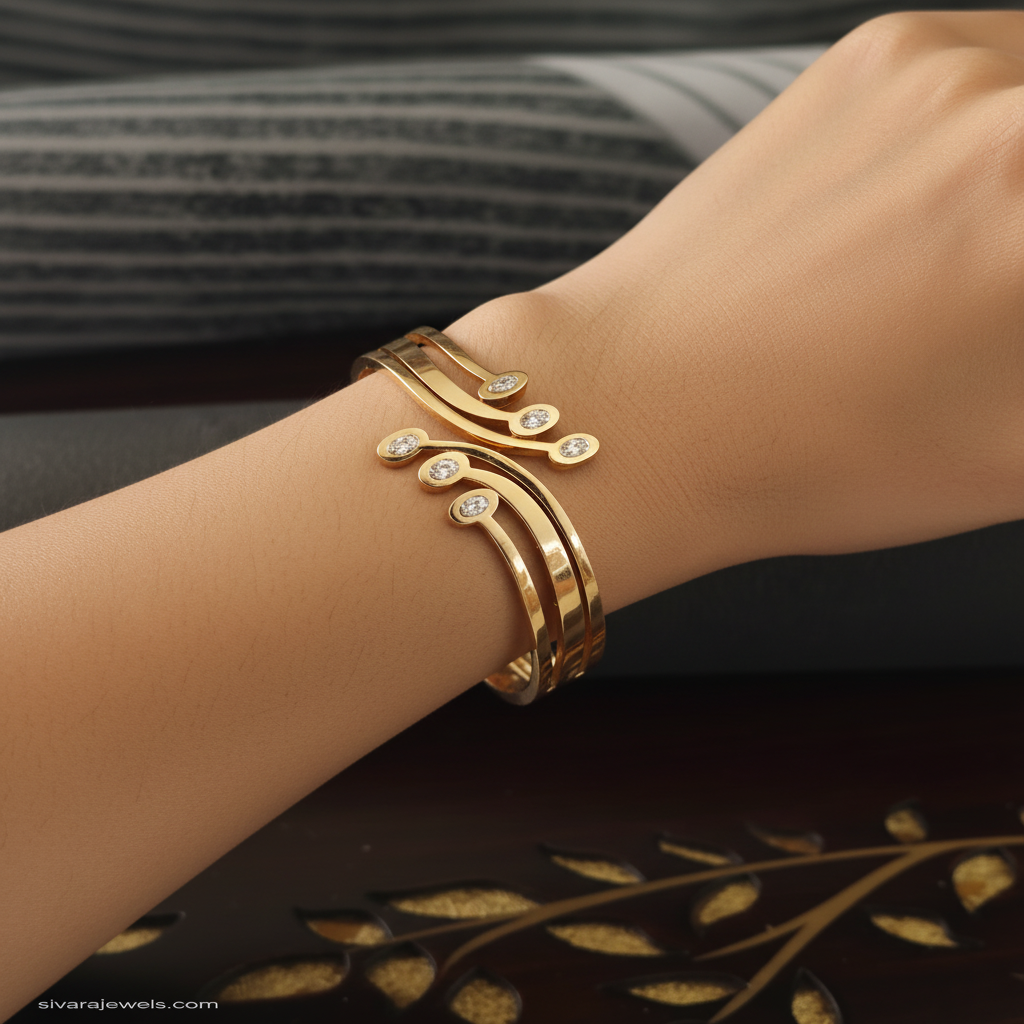 Beautiful slender wrist with flowing curved gold and diamond bracelet