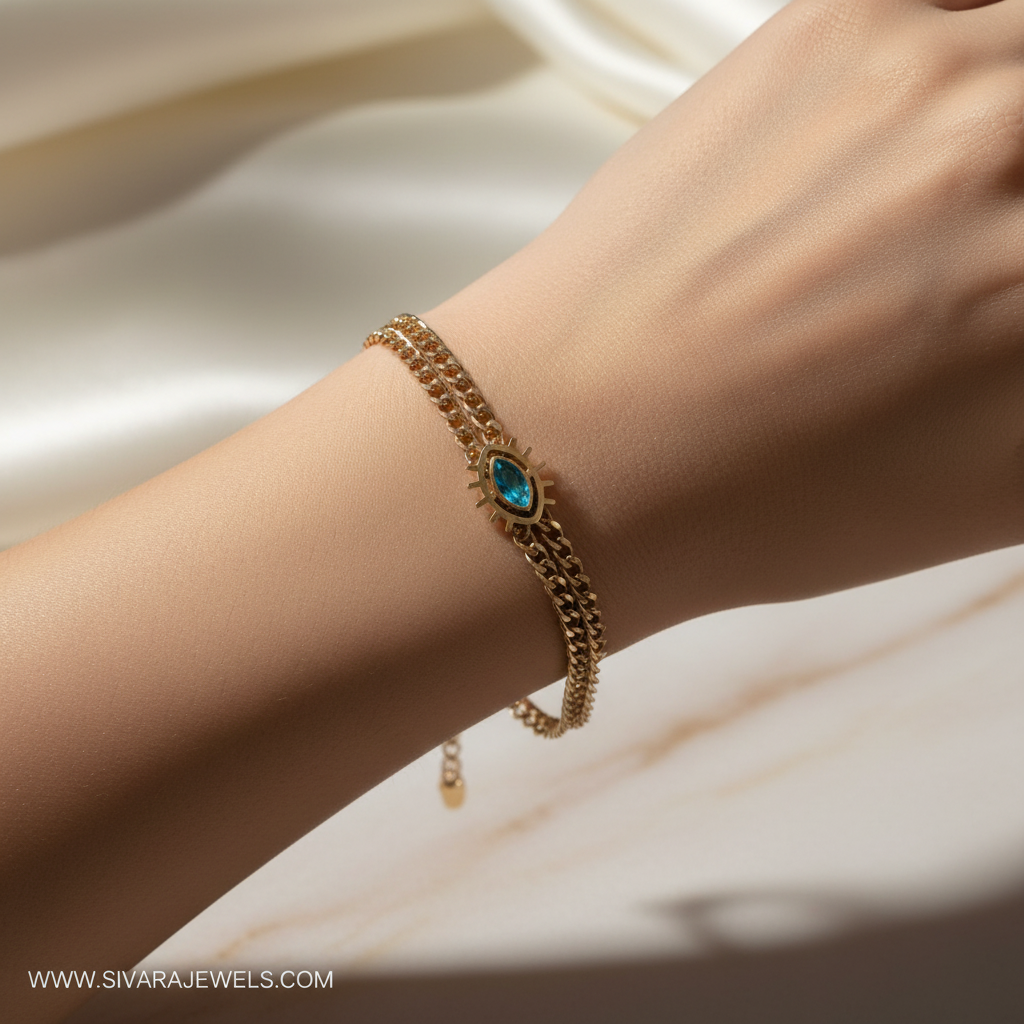Beautiful slender wrist with gold turquoise evil eye bracelet