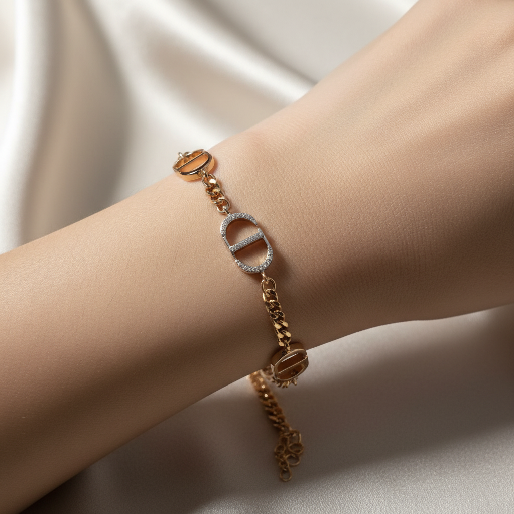 Beautiful slender wrist with mixed-metal D-shaped stirrup link bracelet