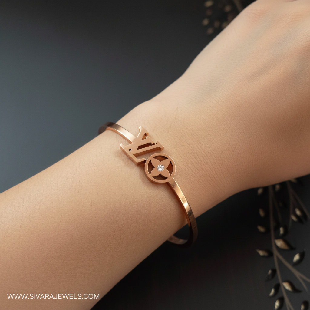 Beautiful slender wrist with rose gold designer logo and diamond bracelet