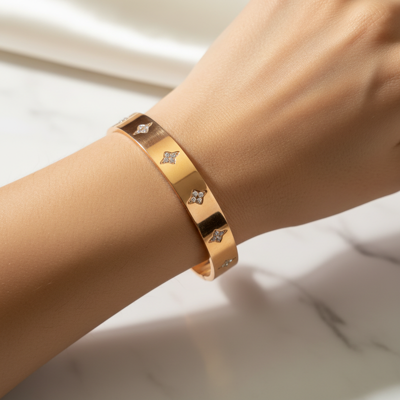 Beautiful slender wrist with rose gold diamond quatrefoil bangle