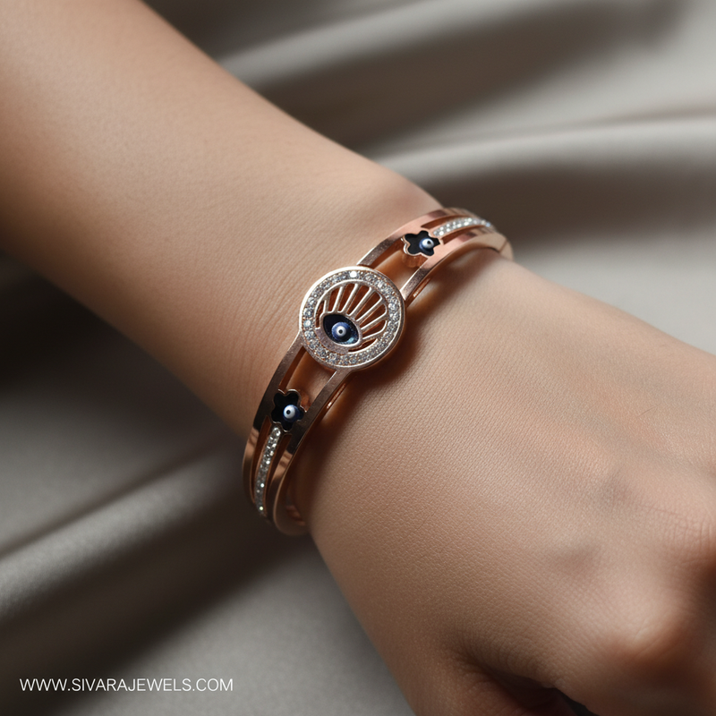 Beautiful slender wrist with rose gold evil eye and diamond bracelet