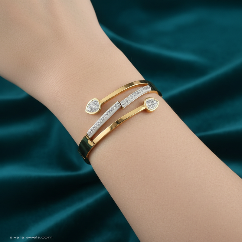 Beautiful slender wrist with teardrop diamond and gold bracelet