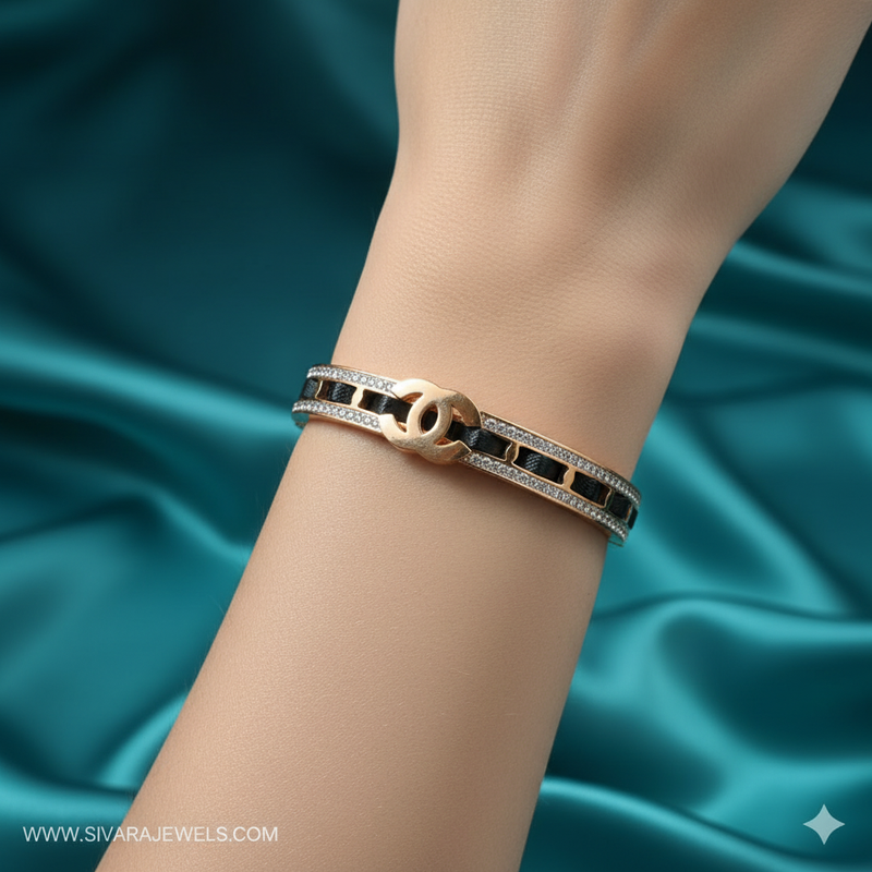 Beautiful slender wrist with two-tone designer logo and diamond bracelet