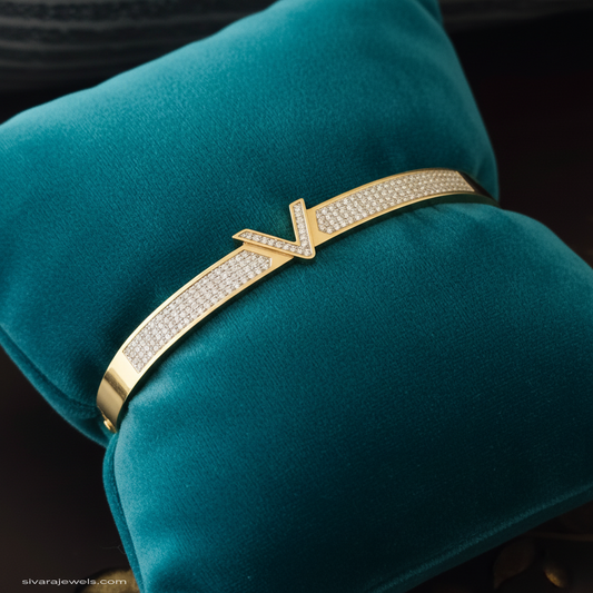 Diamond bracelet stacked on teal velvet cushion