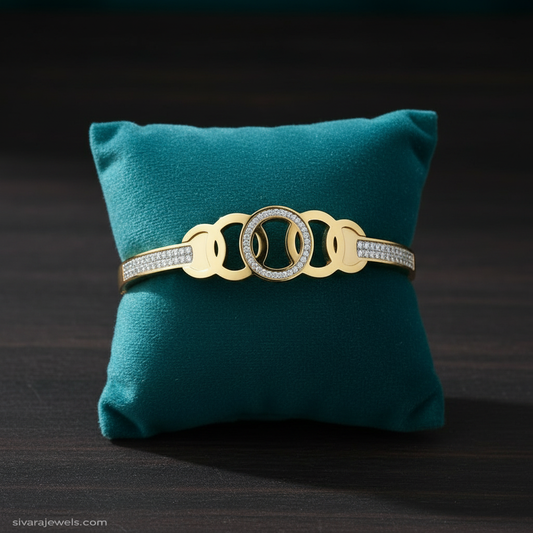 Gold and diamond bracelet with teal velvet cushion through center
