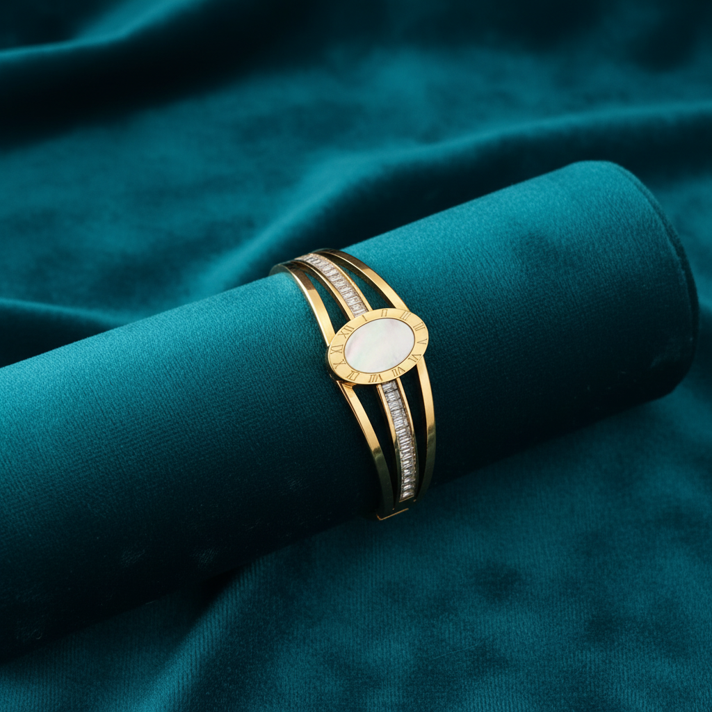 Mother of pearl and baguette diamond bracelet on teal jewelry cushion with teal background