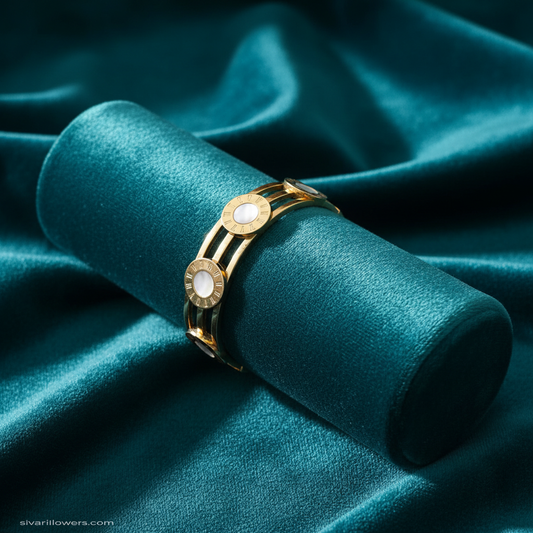 Mother of pearl medallion bracelet on teal jewelry cushion with teal background