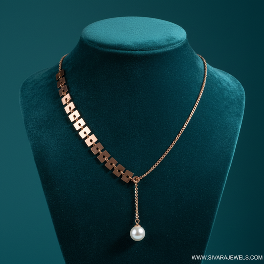 Rose Gold Asymmetric Chain with Cube Beads and Pearl Drop on Teal Velvet