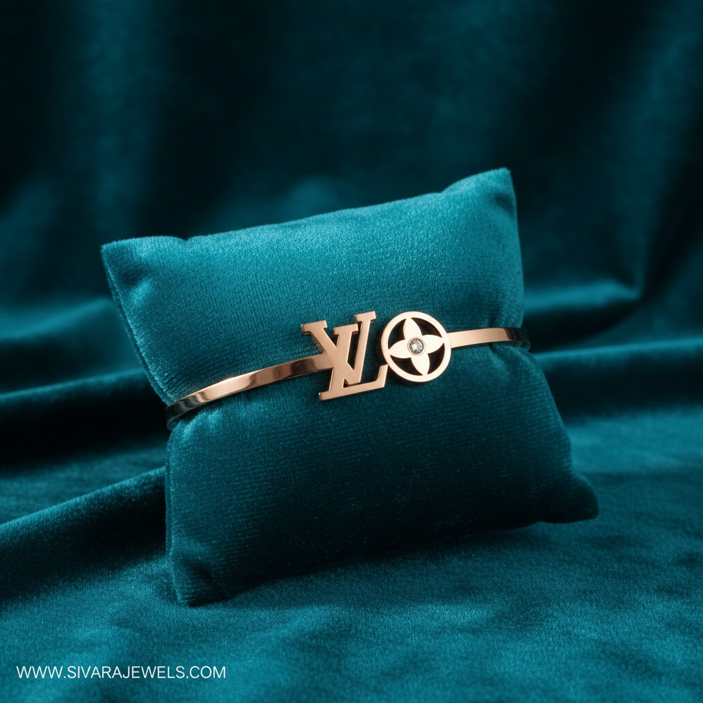 Rose gold designer logo and diamond bracelet on teal jewelry cushion with teal background