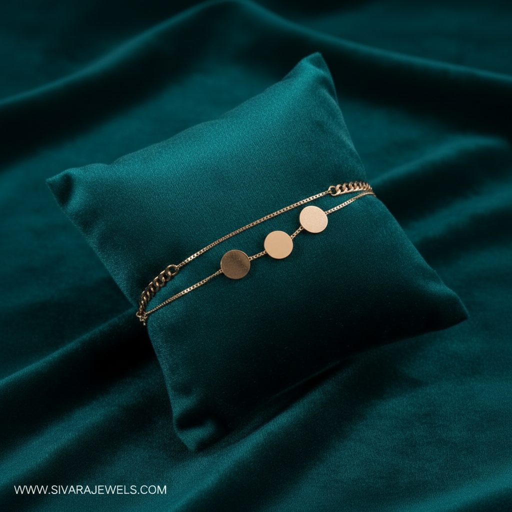 Rose gold disc danglers bracelet on slanted square dark teal cushion