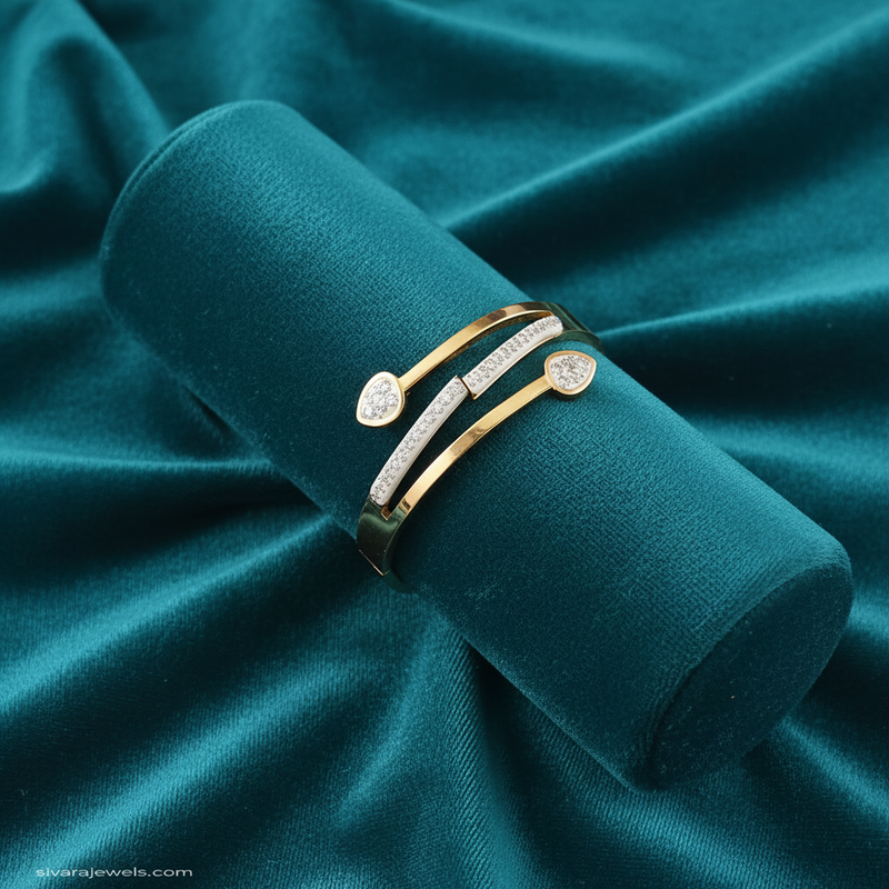 Teardrop diamond and gold bracelet on teal jewelry cushion with teal background