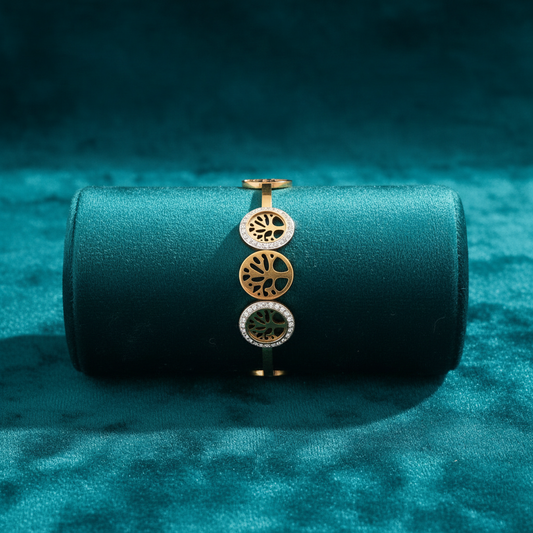 Tree of life medallion bracelet with alternating gold and white on teal cushion